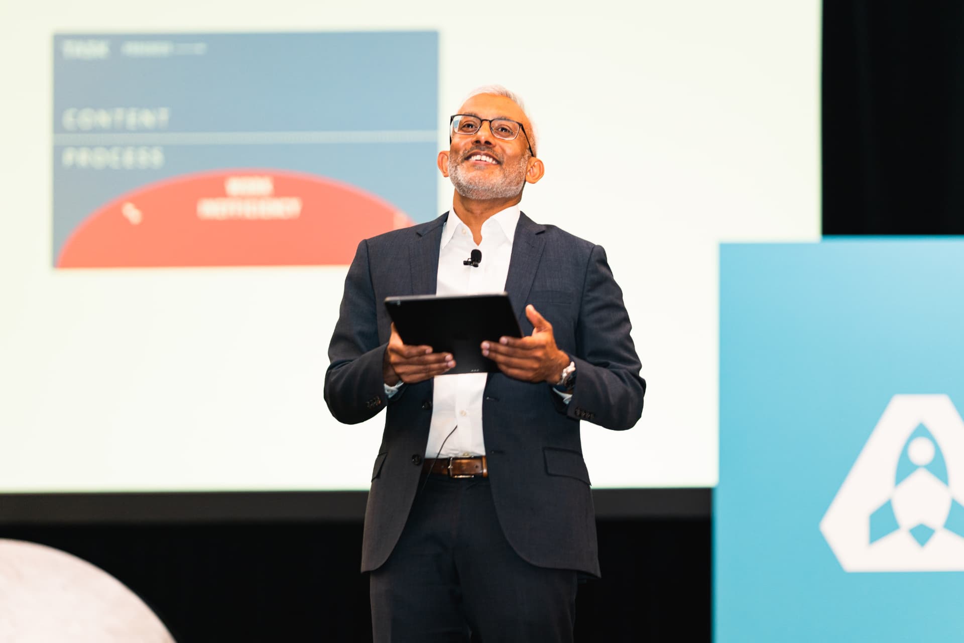 Keynote speaker presenting on a conference stage