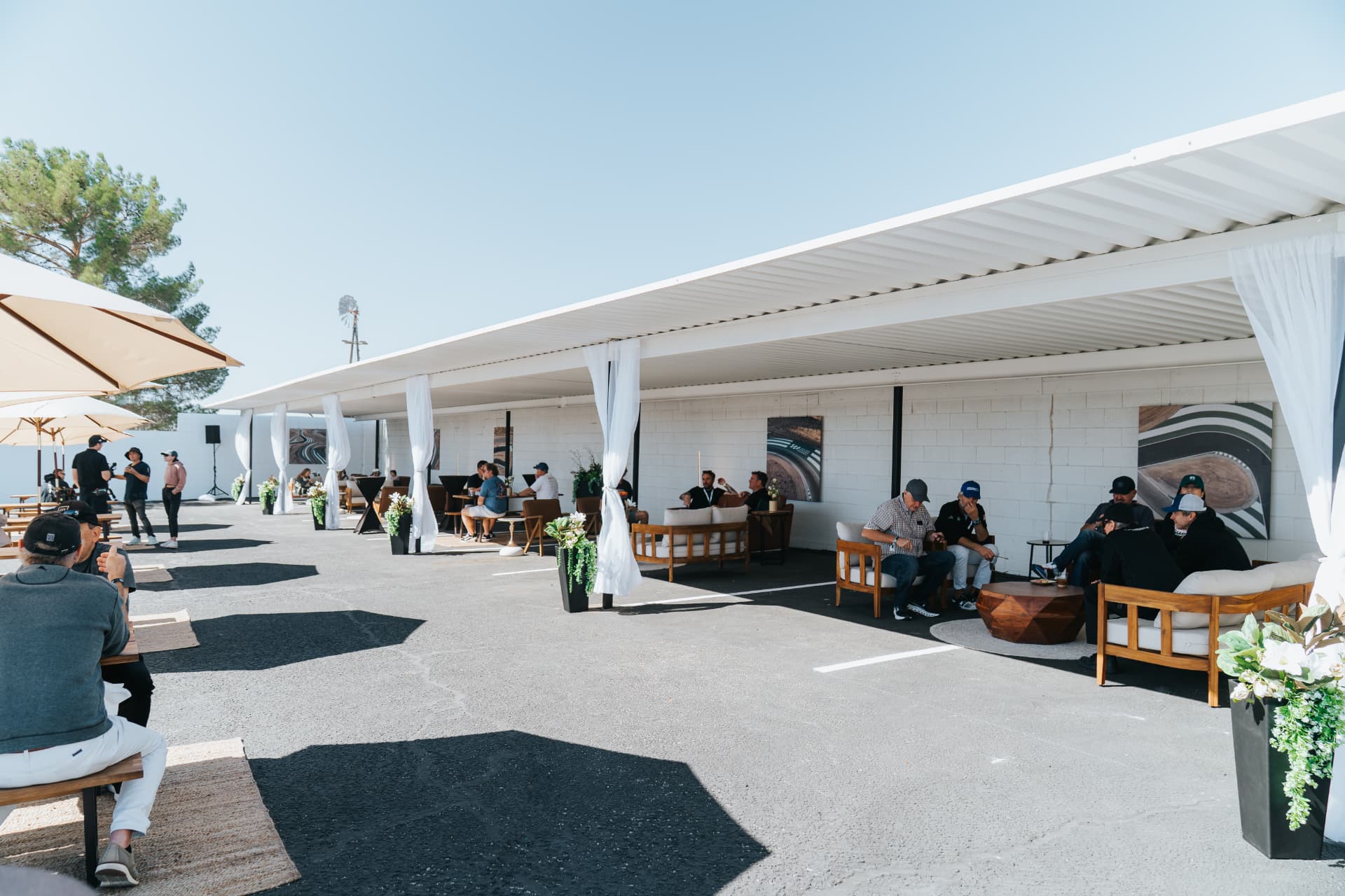 Open-air lounge at a trackside hospitality build