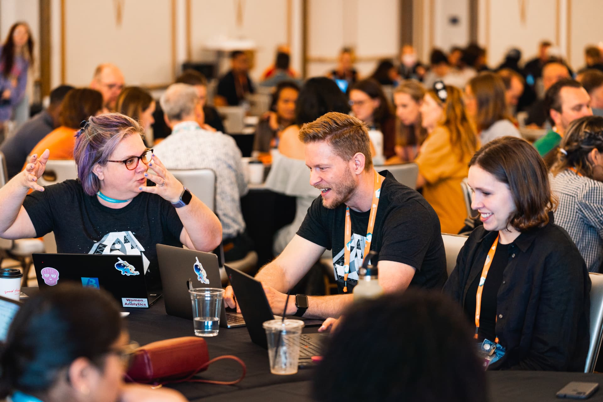 Attendees collaborating during a conference session