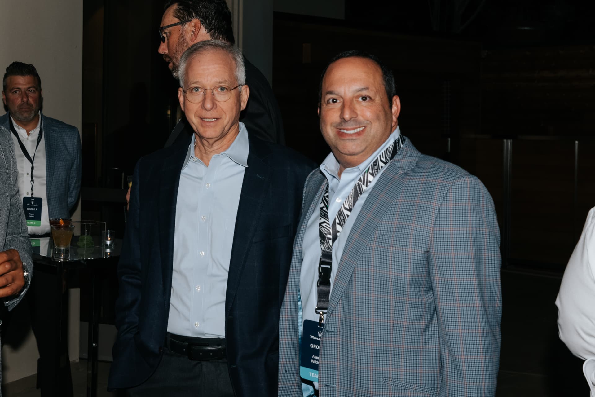 Executives at a dealer summit welcome reception