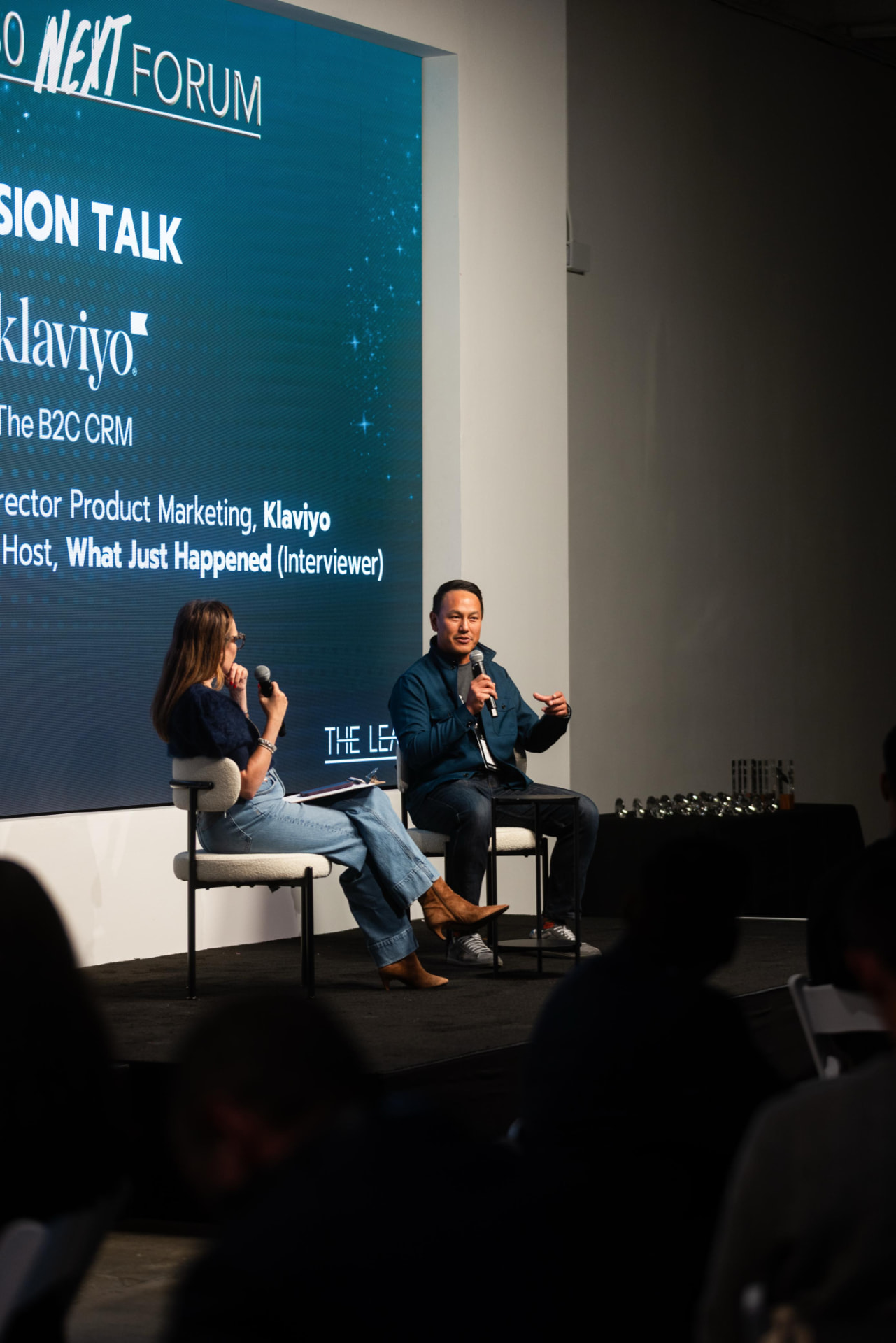 Fireside chat on stage at an industry forum