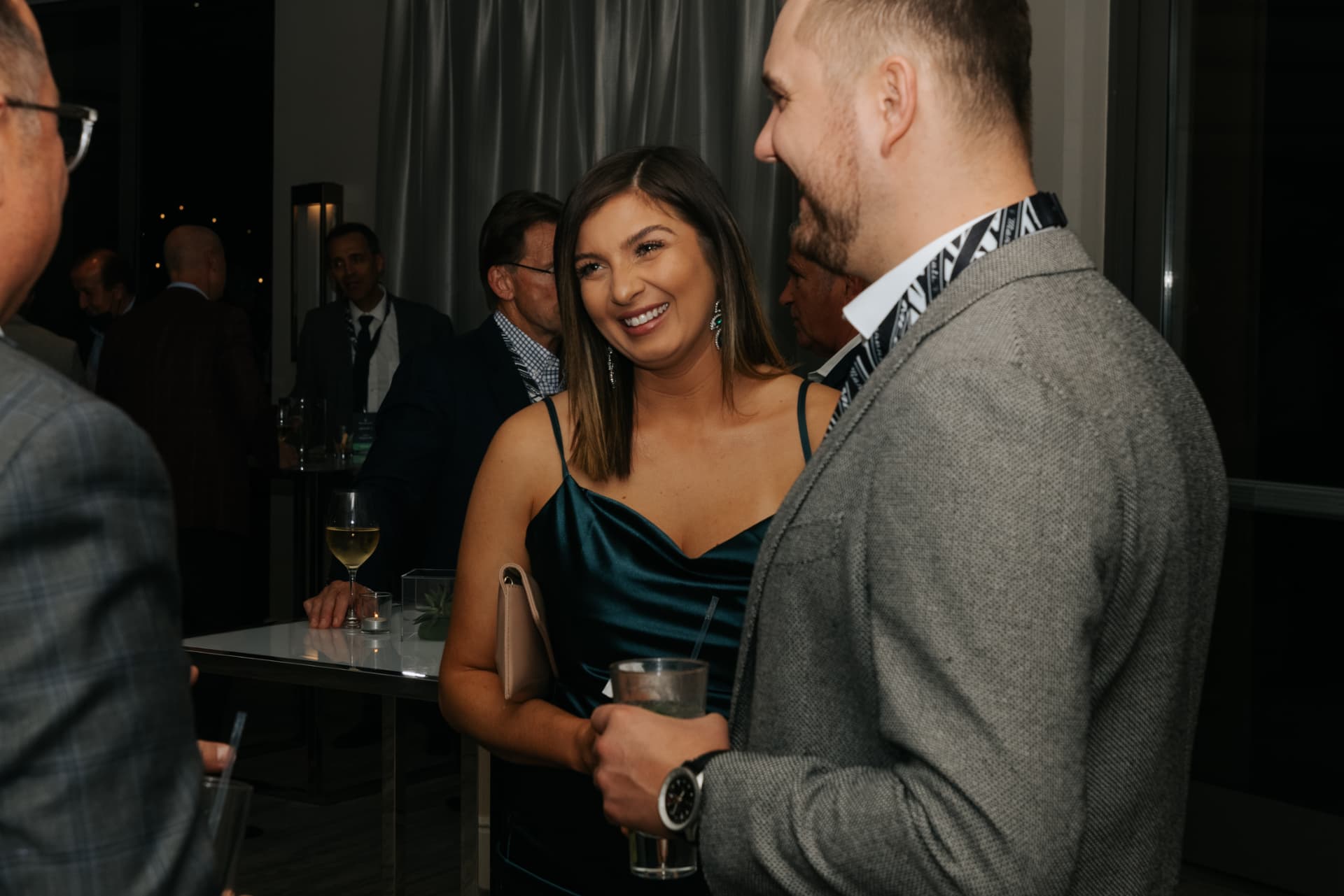 Guests in conversation at a summit cocktail hour
