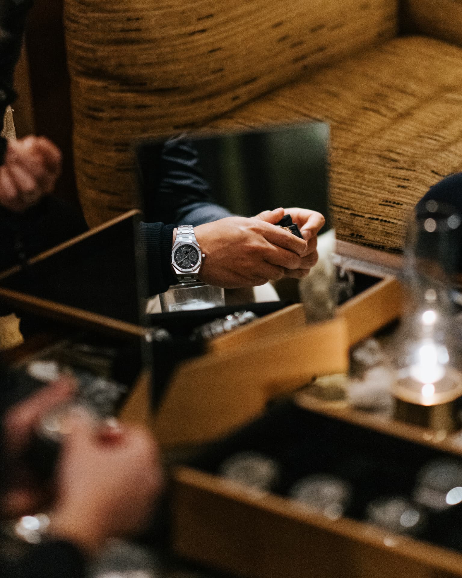 Guest examining a luxury watch display