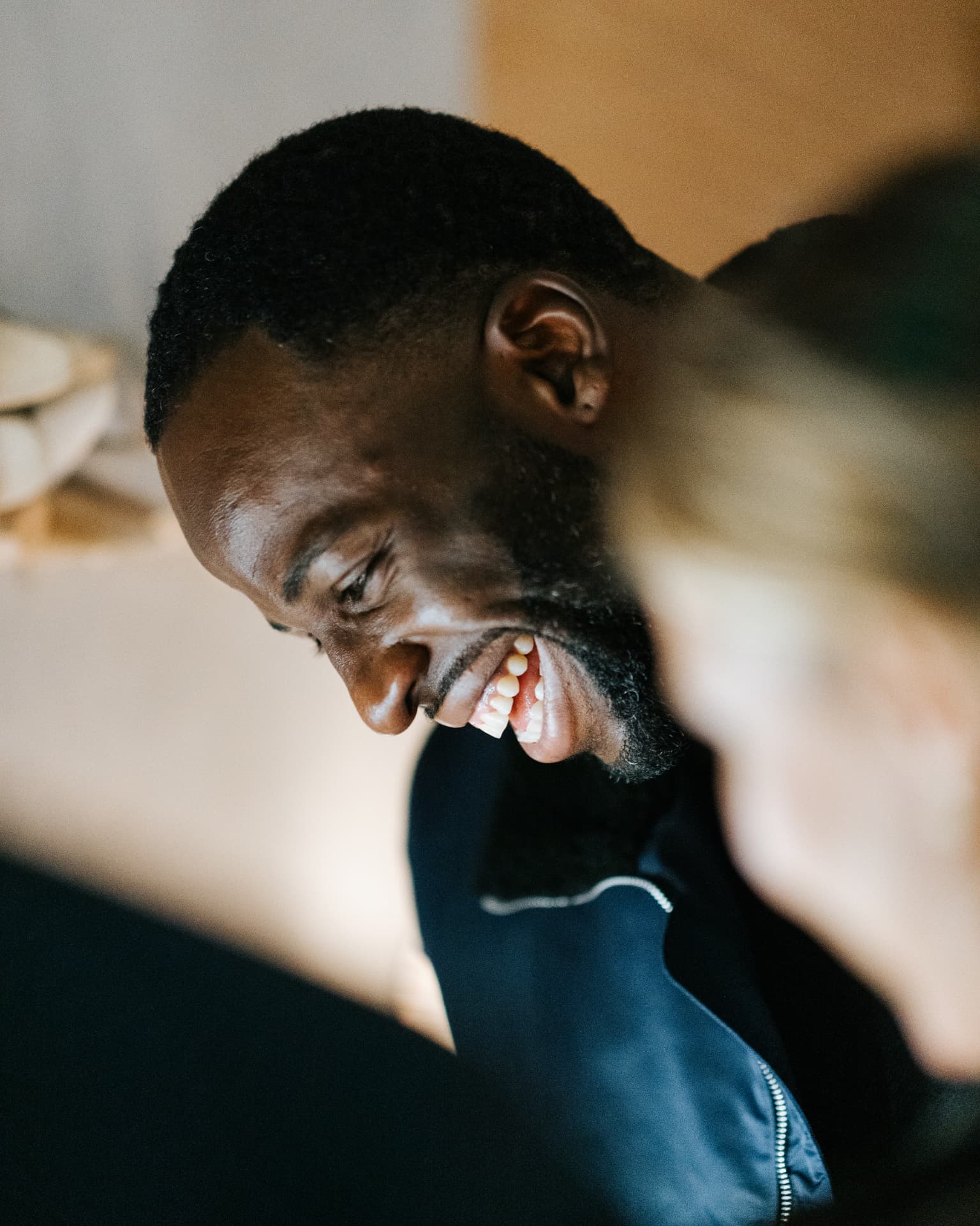 Guest laughing during dinner conversation