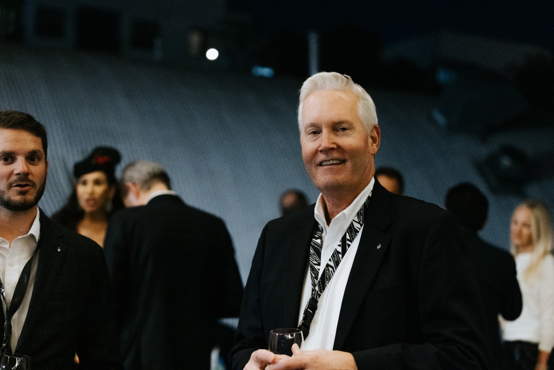 Guest smiling at an evening reception