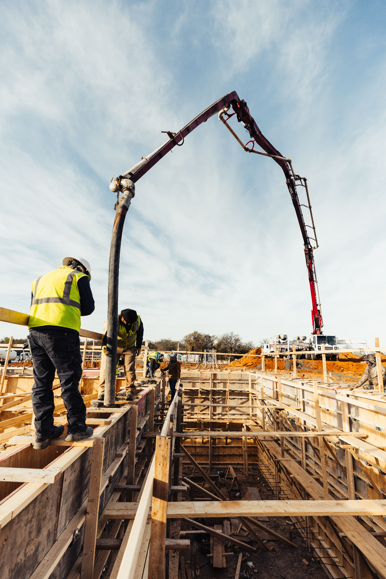 Concrete pour with pump truck on construction site