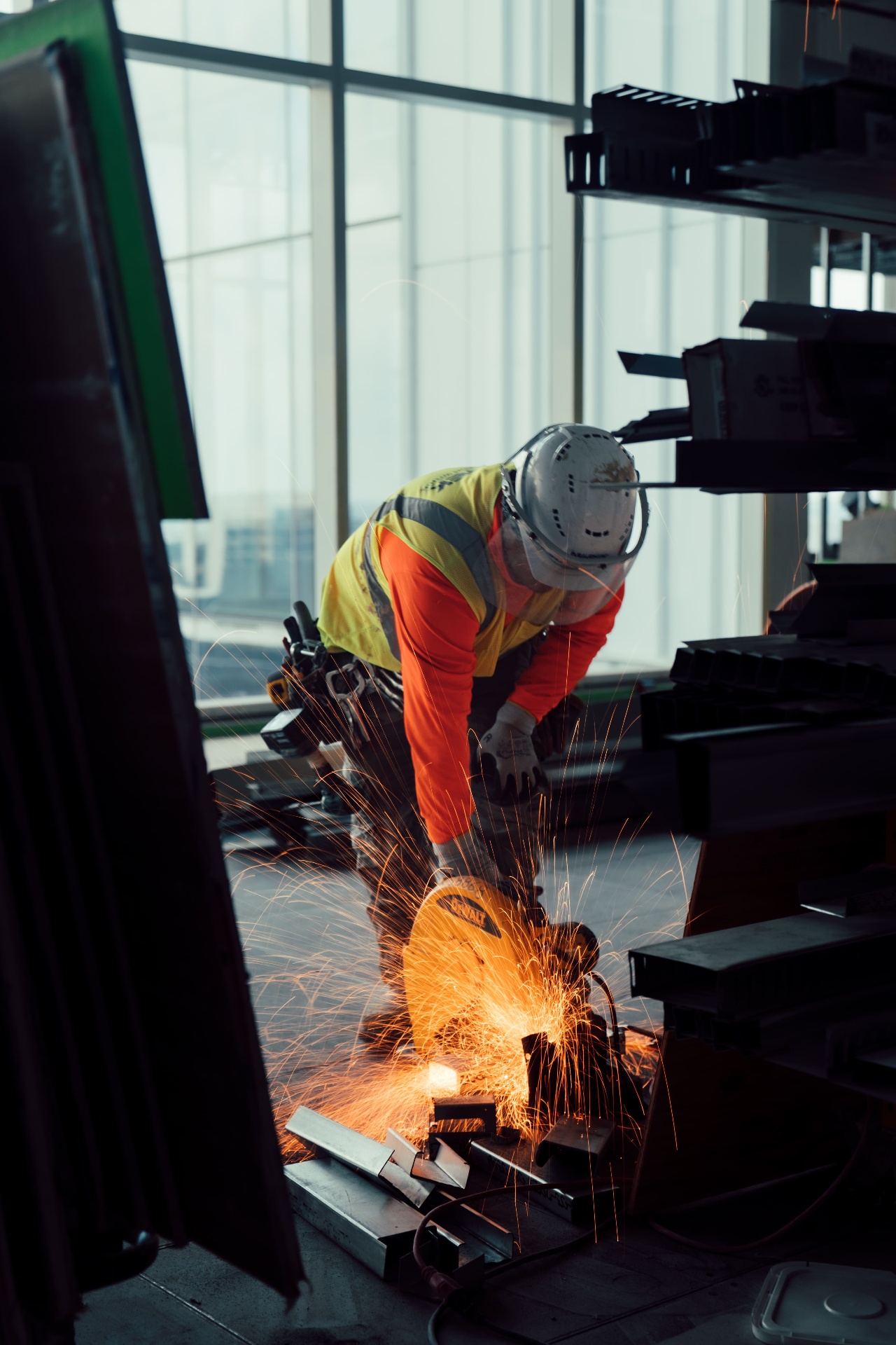 Steel cutting with sparks on interior jobsite