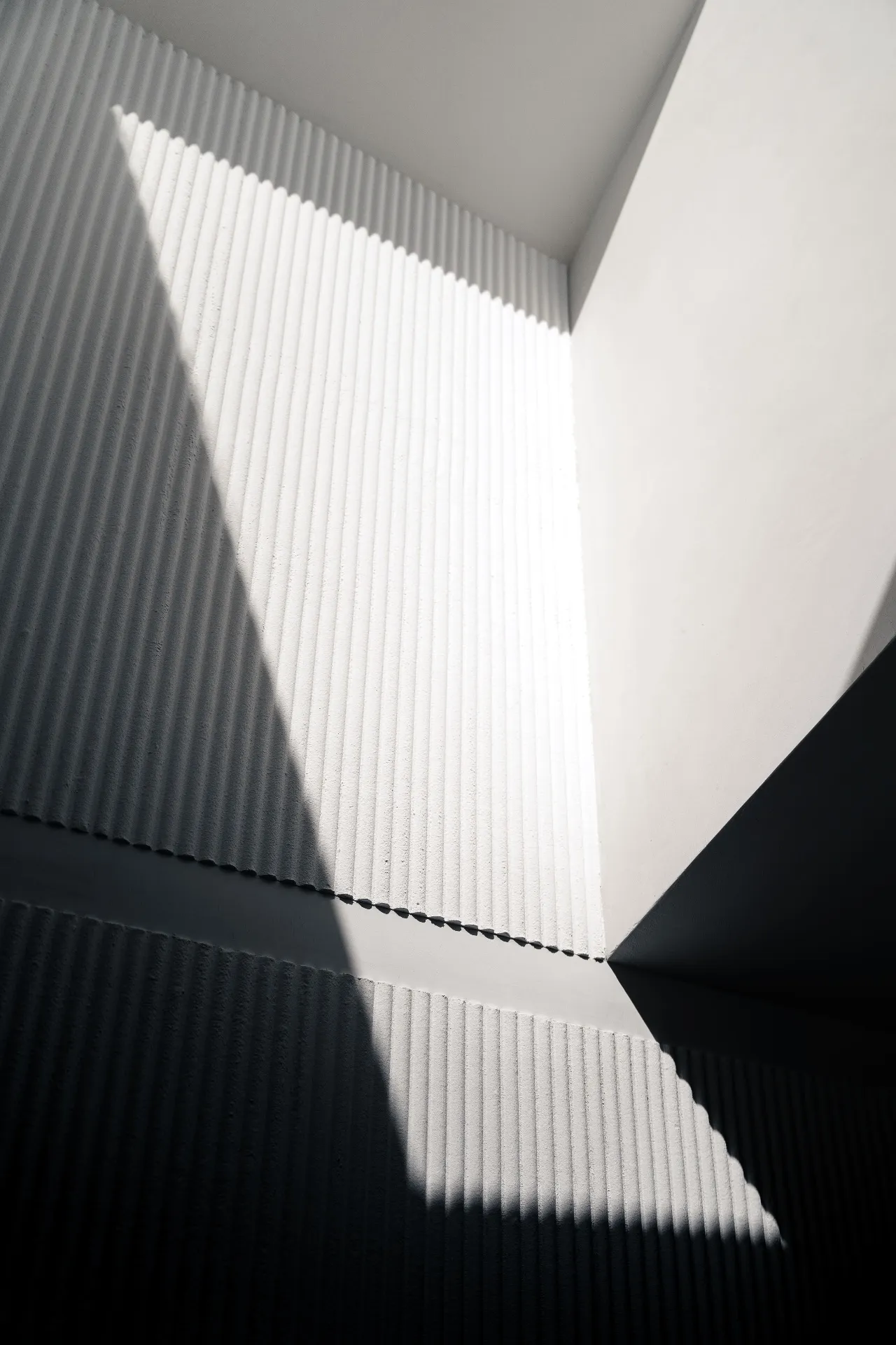 Dramatic light on fluted wall