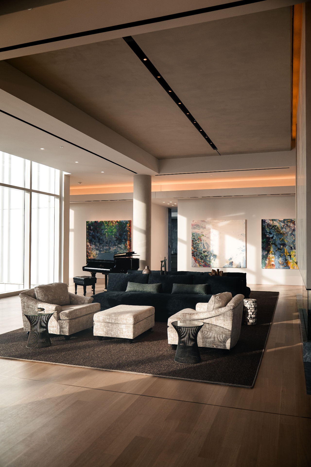 Hall Arts living room with grand piano and art collection