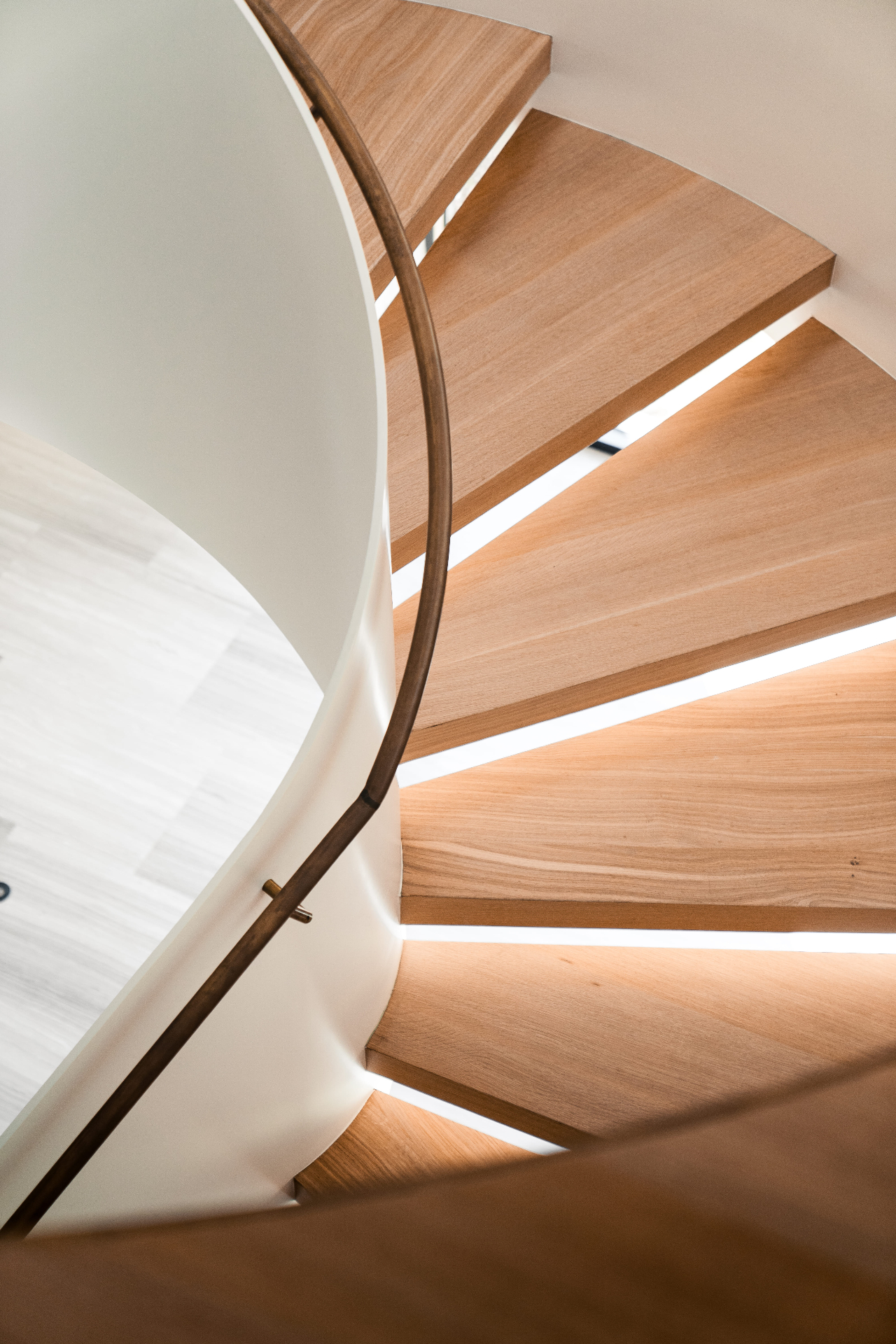 Spiral staircase wood treads with LED detail