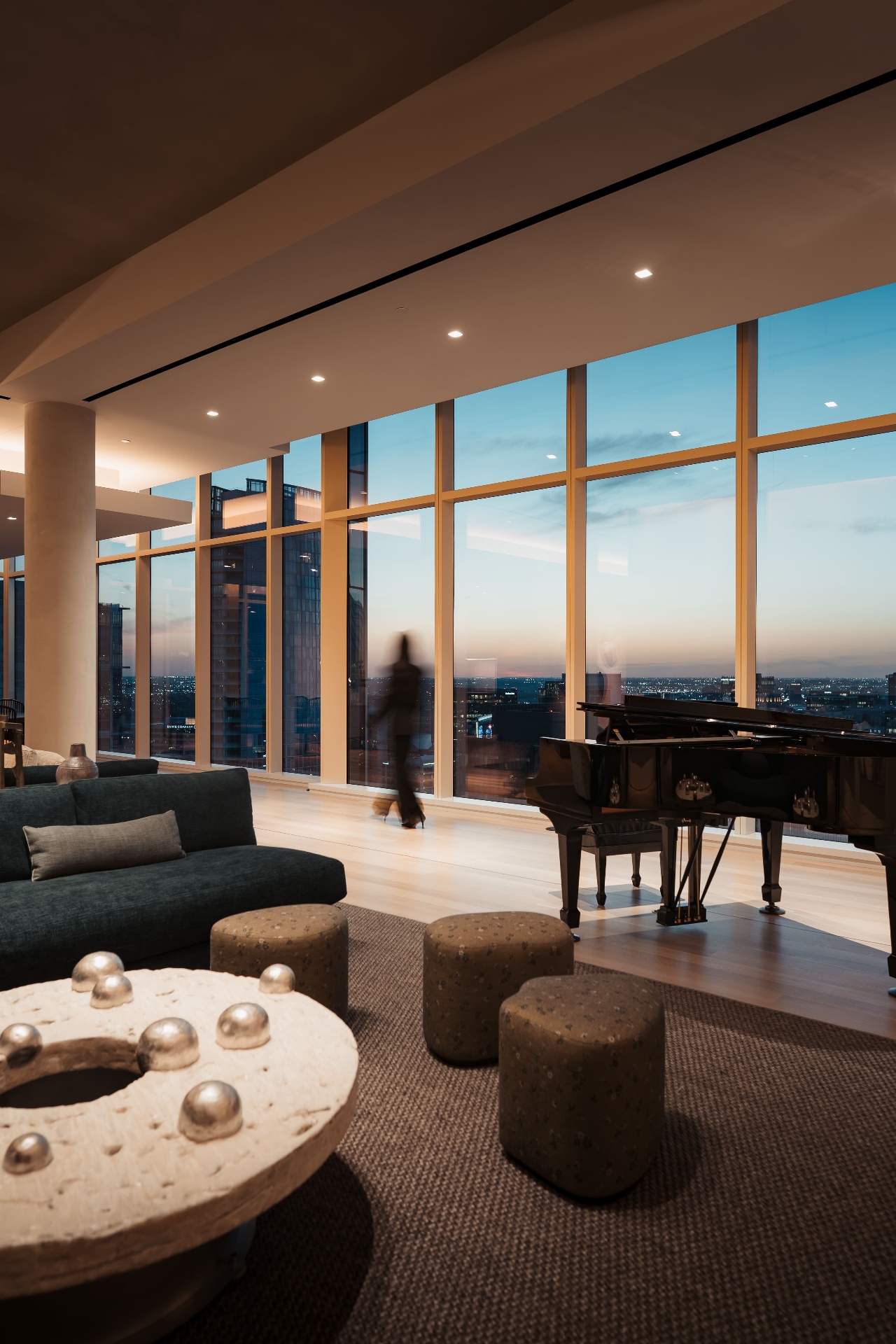 Hall Arts penthouse at sunset with piano and city views