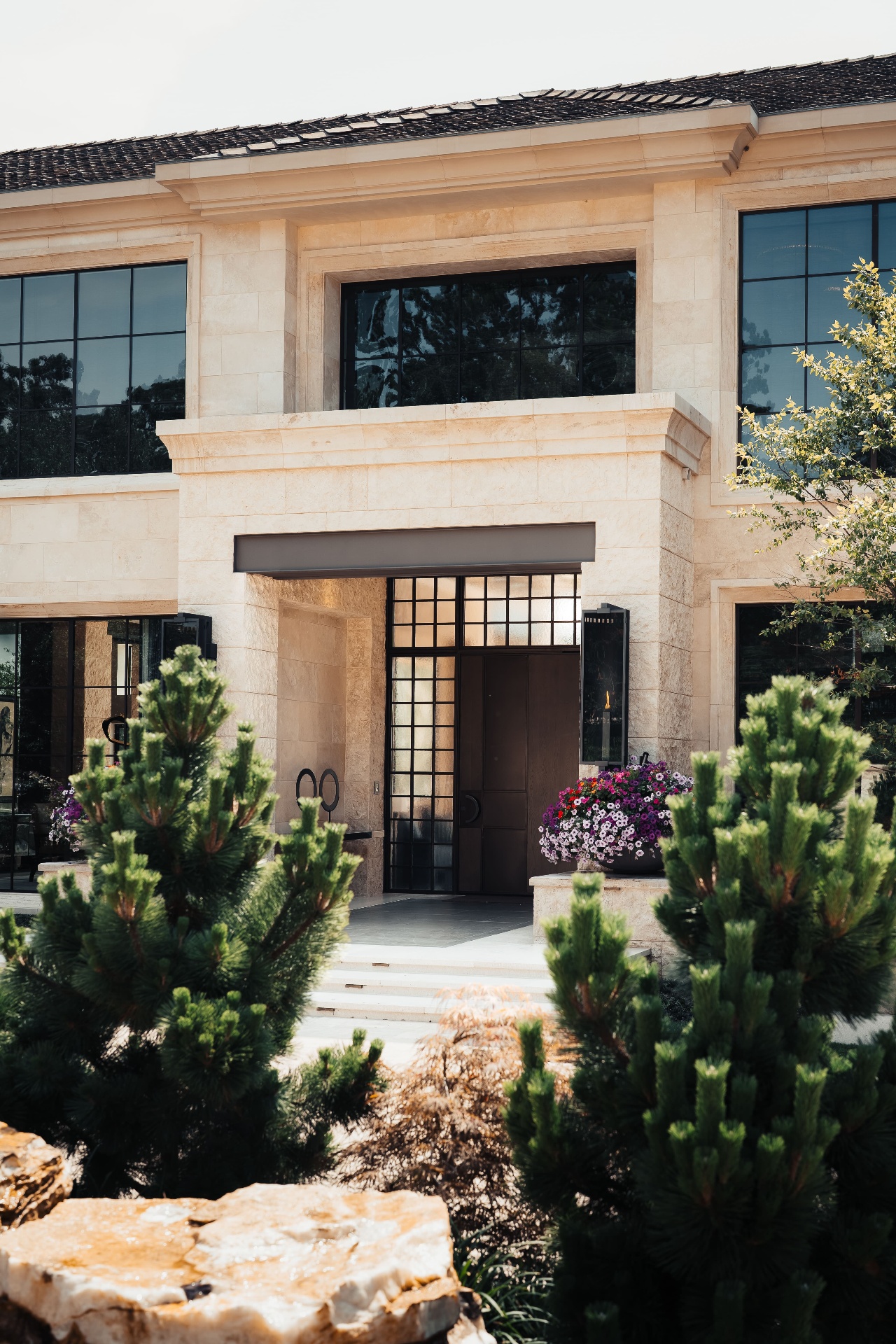 Front entrance with iron door and landscaping
